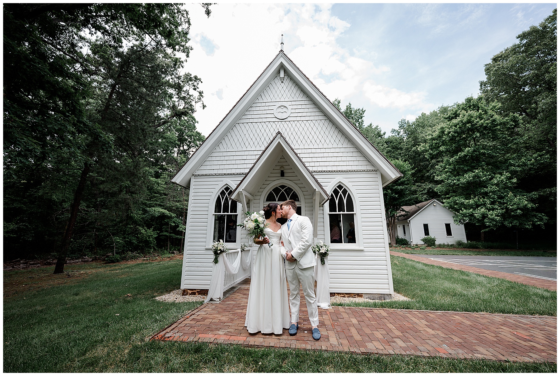 Bride and groom in front of the chapel